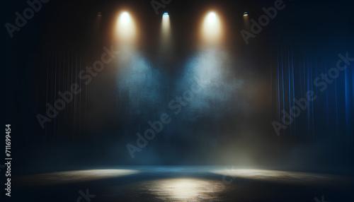 A wide, cinematic shot of an empty stage with atmospheric lighting. The background features photo