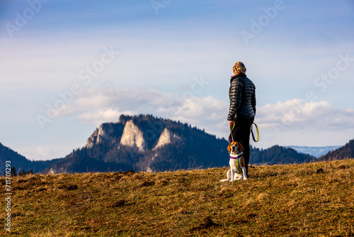 spending time with a dog during a mountain hike