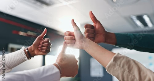 Business people, hands and thumbs up for teamwork, success or good job in unity together at office. Closeup of creative employees with like emoji, yes sign or OK for winning, synergy or group startup photo