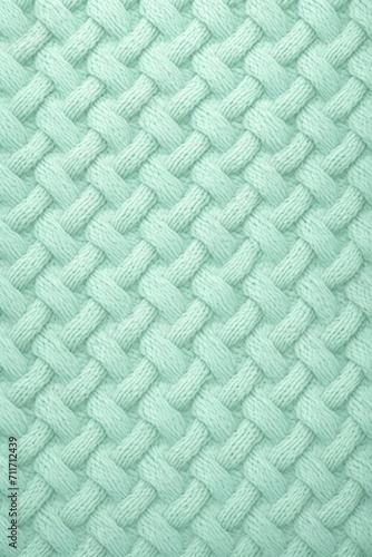 Cozy and comforting seamless pattern featuring a warm and inviting knit sweater texture in a soft mint color
