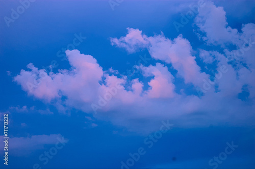 blue sky with pink and white clouds