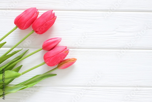Fototapeta Naklejka Na Ścianę i Meble -  Red tulips on white wooden background, women´s day, mothers day, valentine, wedding, birthday, freeting card