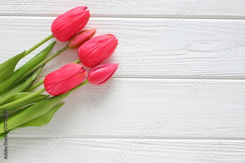 Fototapeta Naklejka Na Ścianę i Meble -  Red tulips on white wooden background, women´s day, mothers day, valentine, wedding, birthday, freeting card