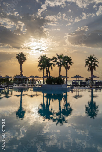 Scenic view of swimming pool by swimming pool against sky during sunset