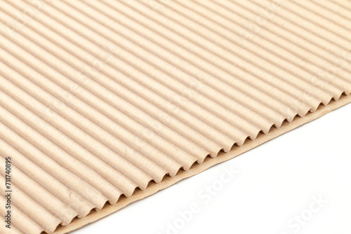 fragment of corrugated cardboard on a white background for advertising and design  close-up