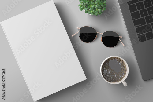 Blank book with sun glass, green flower, cup coffee, and laptop mockup (ID: 711741265)