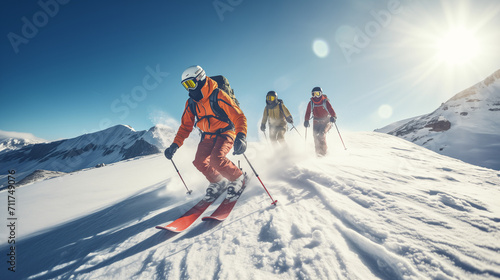 3 friends going down a ski slope on a bright sunshiny day in winter photo