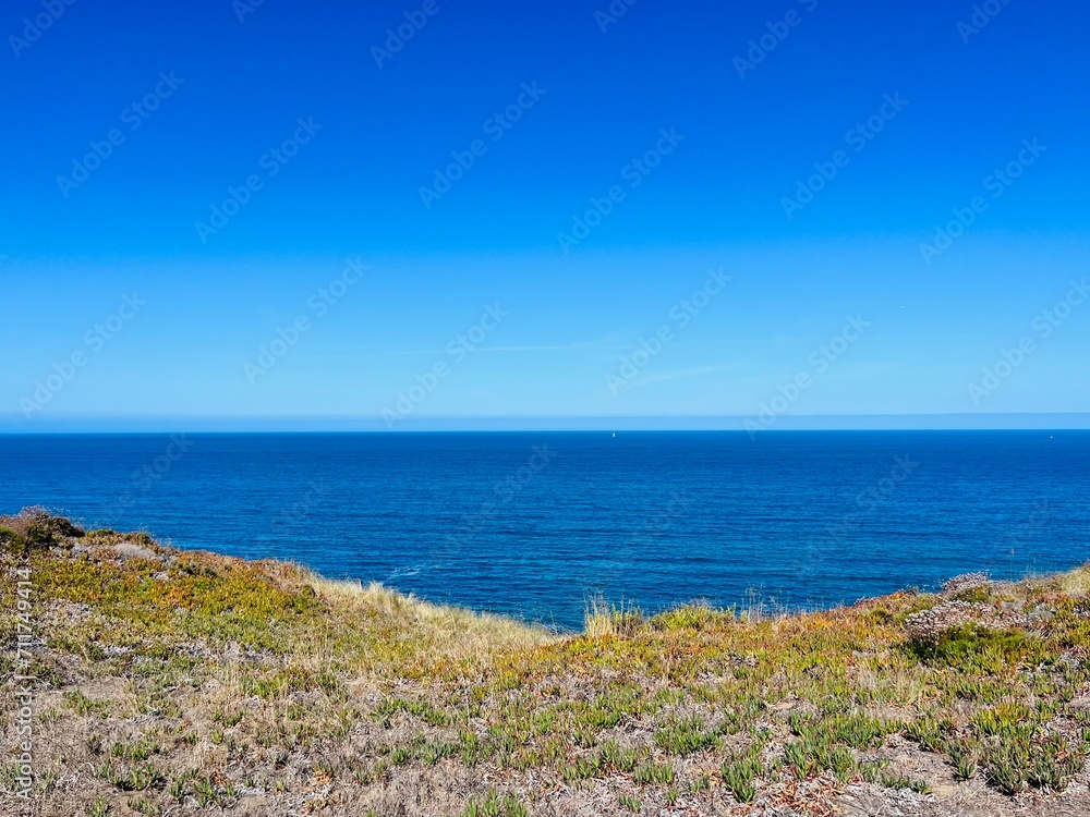 Ocean coastline, ocean coast, blue ocean horizon, clear blue sky, summer adventures