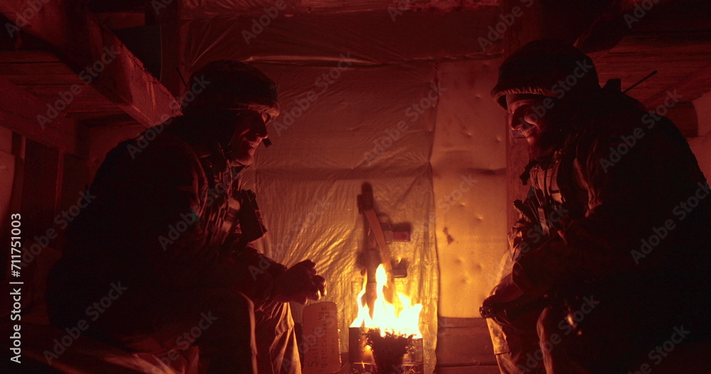 Confession of a Ukrainian soldier in a dark dugout. The chaplain and the warden sit opposite each other and talk. Confession of a Ukrainian soldier in a dark dugout. The chaplain and the warden sit opposite each other and talk.