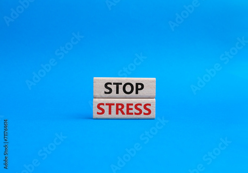 Stop Stress symbol. Concept word Stop Stress on wooden blocks. Beautiful blue background. Business and Stop Stress concept. Copy space