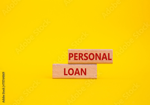Personal Loan symbol. Concept word Personal Loan on wooden blocks. Beautiful yellow background. Business and Personal Loan concept. Copy space