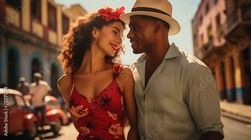 Beautiful young Cuban couple smiling and dancing on the street. Latin American man and woman enjoying a romantic relationship. Dating and falling in love.
