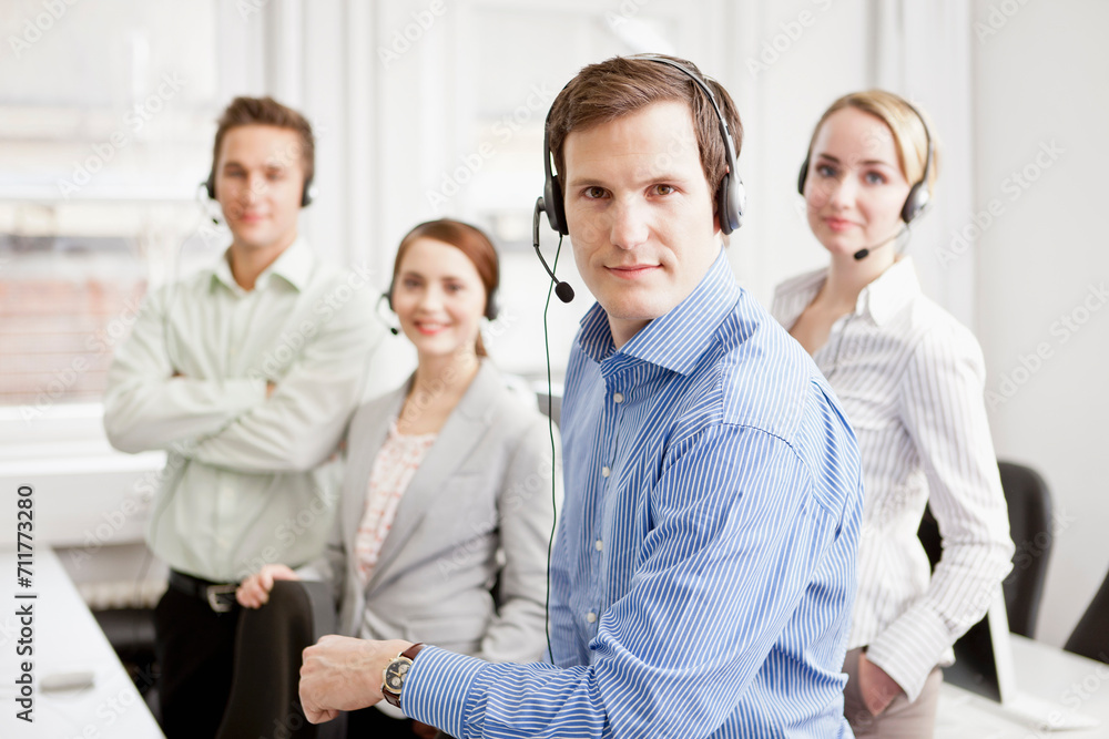 Colleagues working in a call center with a very friendly atmosphere. Munich, Germany Colleagues working in a call center with a very friendly atmosphere. Munich, Germany