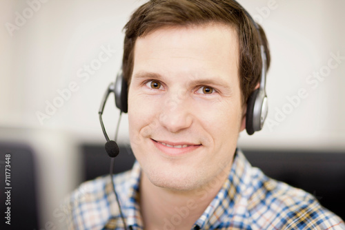Colleagues working in a call center with a very friendly atmosphere. Munich, Germany