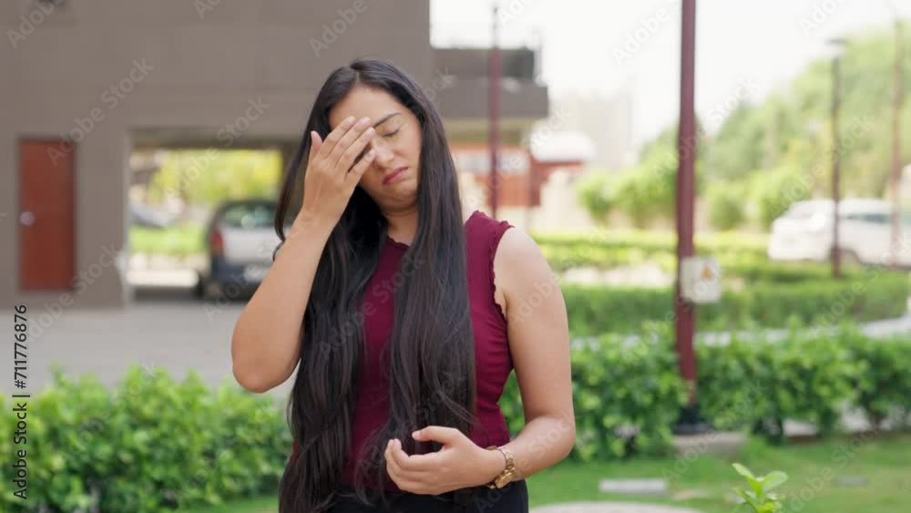 Sad Indian Woman Looking at her Hair Sad Indian Woman Looking at her Hair