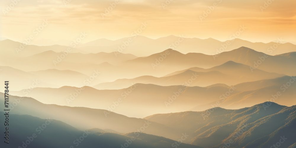 Misty mountain landscape at sunrise, blending fog, trees, and hills in a serene and scenic beauty.
