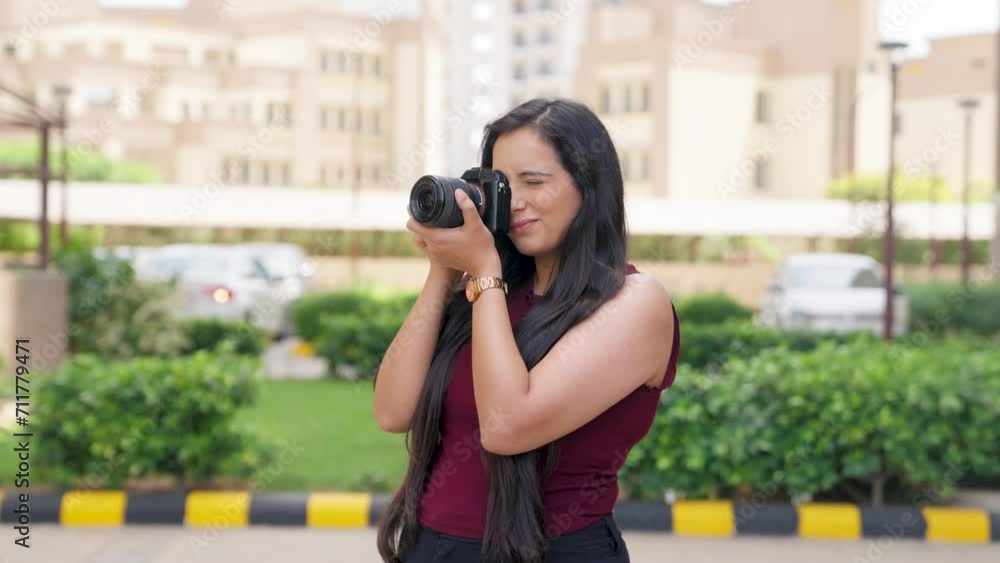 Indian Woman Clicking Pictures with Camera Indian Woman Clicking Pictures with Camera