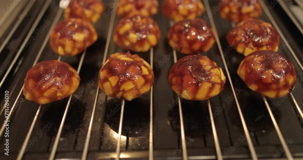 Cooking apple fillings for tarts with apples and jelly in the oven in a professional kitchen. Cooking apple fillings for tarts with apples and jelly in the oven in a professional kitchen.