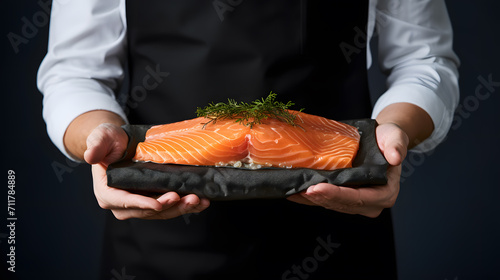 a person holding a piece of salmon