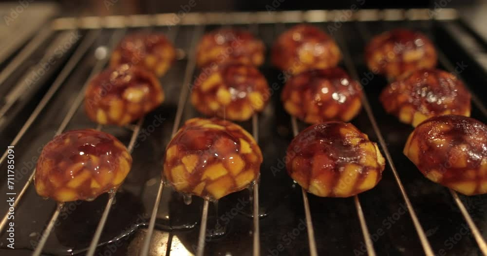 Cooking apple fillings for tarts with apples and jelly in the oven in a professional kitchen. Cooking apple fillings for tarts with apples and jelly in the oven in a professional kitchen.