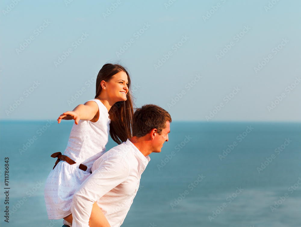 Young happy couple in love in summer day Young happy couple in love in summer day