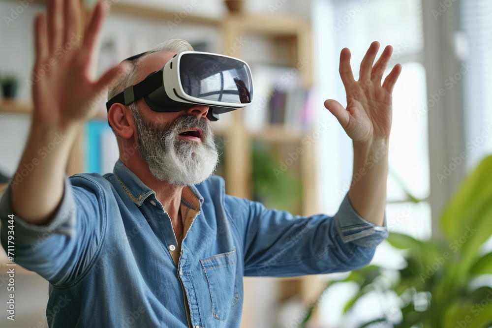 A man with a beard wearing a virtual reality headset A man with a beard wearing a virtual reality headset