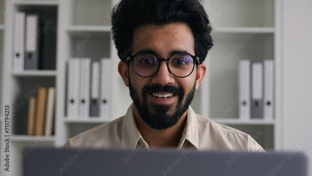 Excited happy Indian Arabian muslim businessman male winner man employee working at home office win laptop celebrate job opportunity online winning business achievement victory finished deal success Excited happy Indian Arabian muslim businessman male winner man employee working at home office win laptop celebrate job opportunity online winning business achievement victory finished deal success