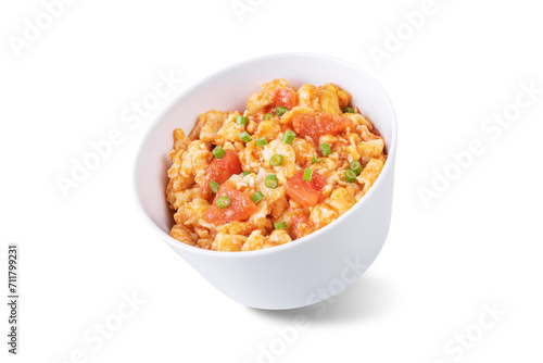 Tomato and eggs stir fry on a white isolated background