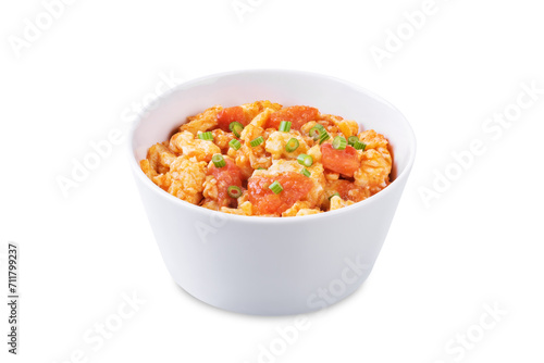 Tomato and eggs stir fry on a white isolated background