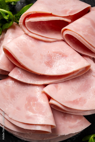 Closeup ham slices, dark background