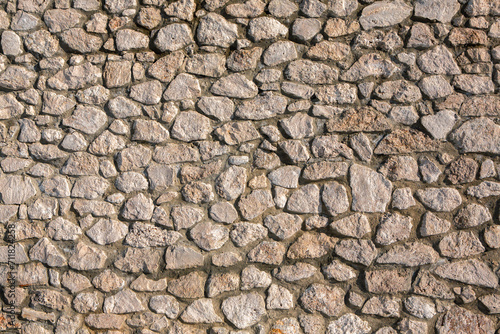 Background of stone wall texture photo. Close-up of stone wall.