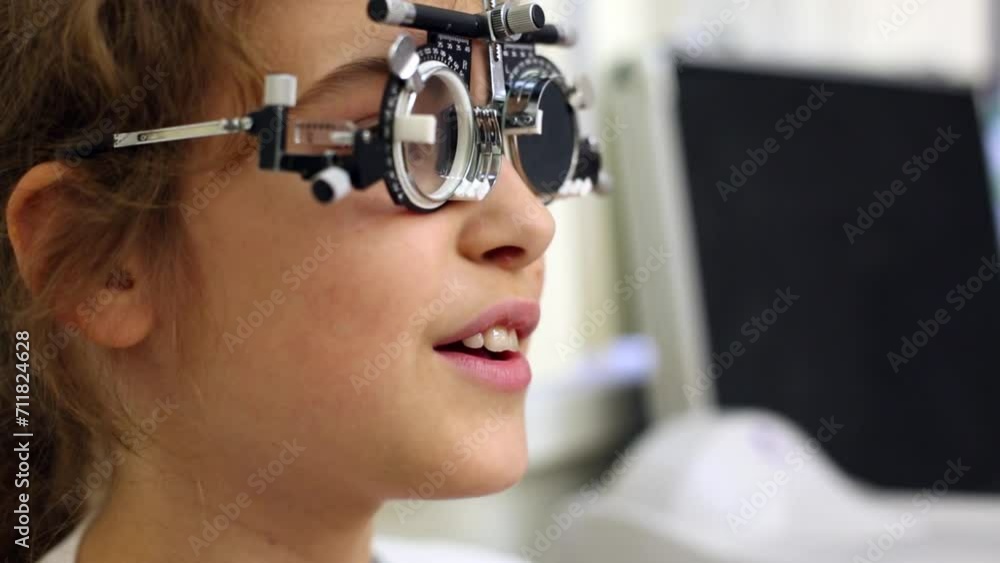 Girl in ophthalmic glasses checks eyesight. Girl in ophthalmic glasses checks eyesight.