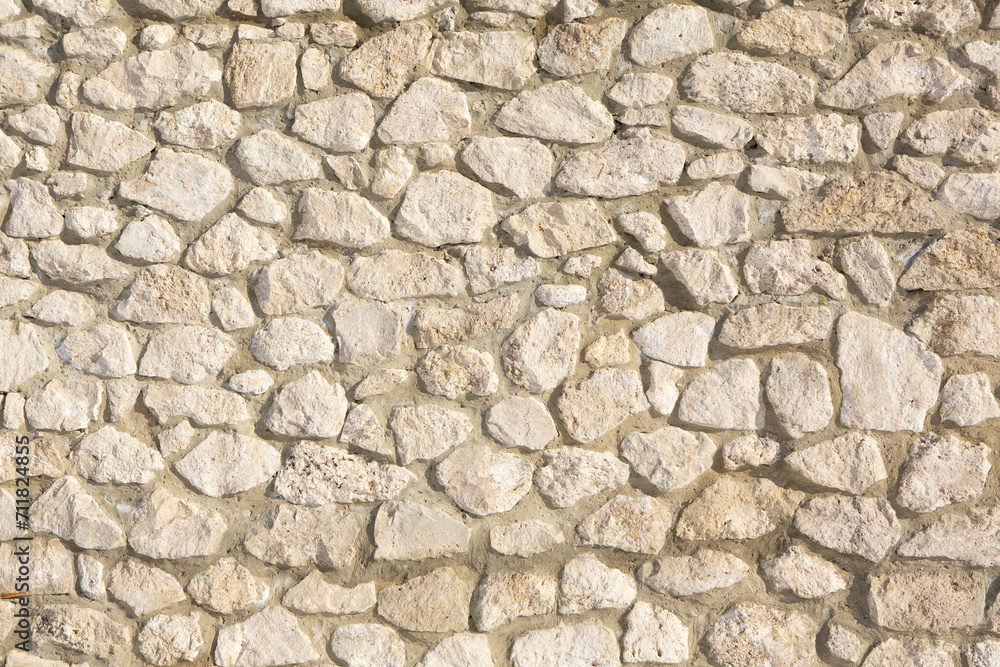 Background of stone wall texture photo. Close-up of stone wall. Background of stone wall texture photo. Close-up of stone wall.