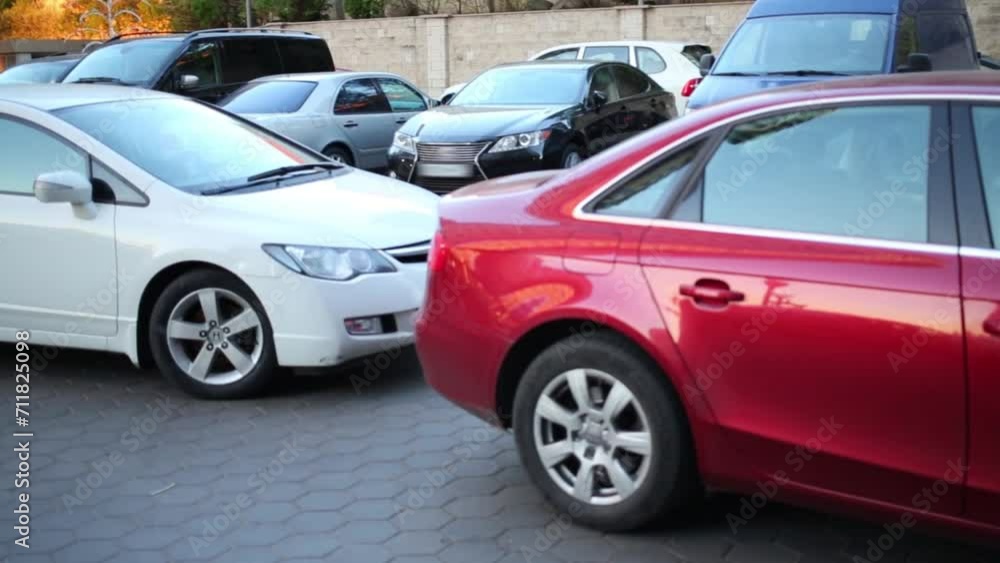 Cars are parking near residential building at summer Cars are parking near residential building at summer