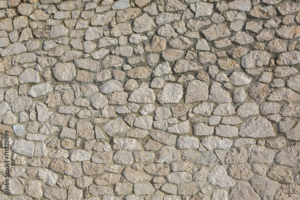 Background of stone wall texture photo. Close-up of stone wall.