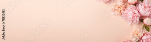 Mother s Day  spring  valentine s day or other celebration holiday concept greeting card template banner panorama long - Peonies on peach fuzz paper table texture background