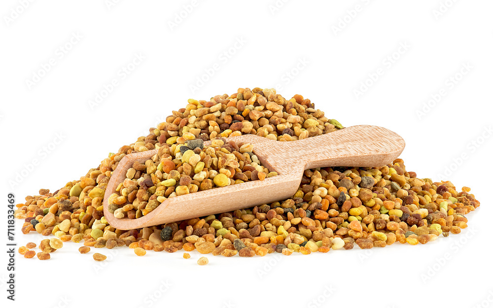 Fototapeta premium Raw organic honey bee pollen in wooden spoon isolated over white background. Bee pollen grains, bee bread.