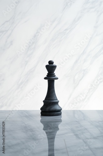 Black chess piece on marble board