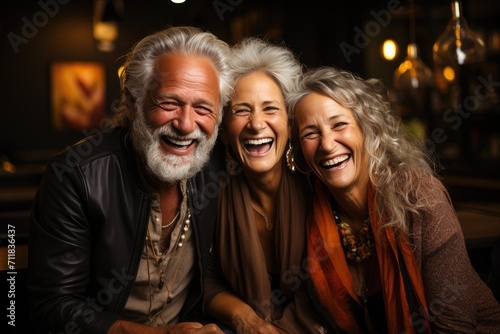 Amidst the cozy indoor setting, a group of friends captured in a candid moment, adorned with genuine smiles and infectious laughter, showcasing the beauty of human connection and joy