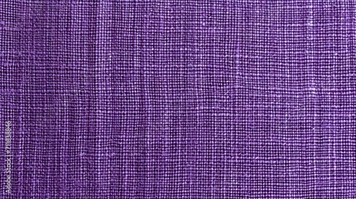 Purple fabric background, linen structure in pink, magenta for fresh textured modern card, appealing new season and colors for fresh nature. Threads close-up, hobby, sewing, cloth.