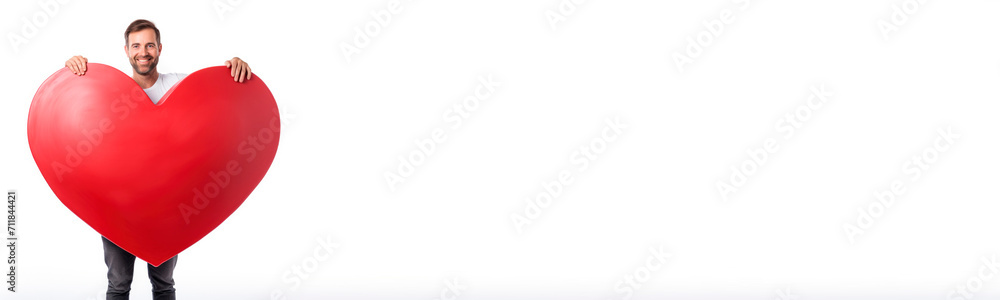 A man holds a huge red heart highlighted on a white background. A banner for Valentine's Day. A man holds a huge red heart highlighted on a white background. A banner for Valentine's Day.