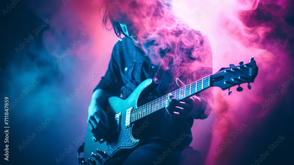 Obraz premium A guitar player making rock during concert. Rock band performs on stage. Guitarist plays solo.