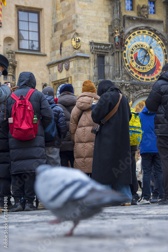 Prague astronomic watch at city central square, above view with people and pigeons
