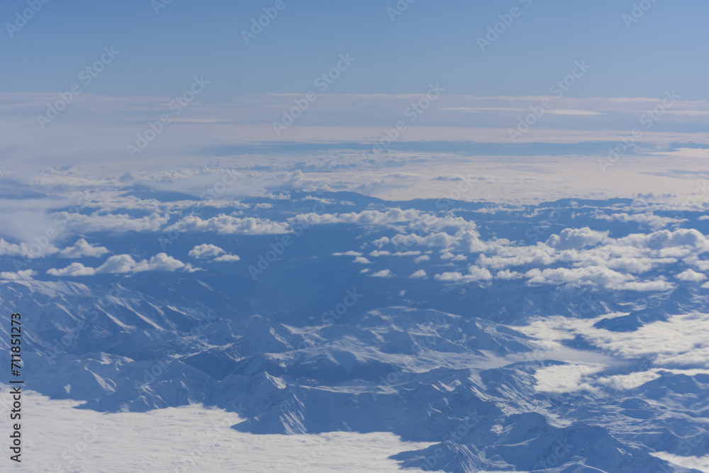 Naklejka premium Alps mountain aerial view in a cloudy day