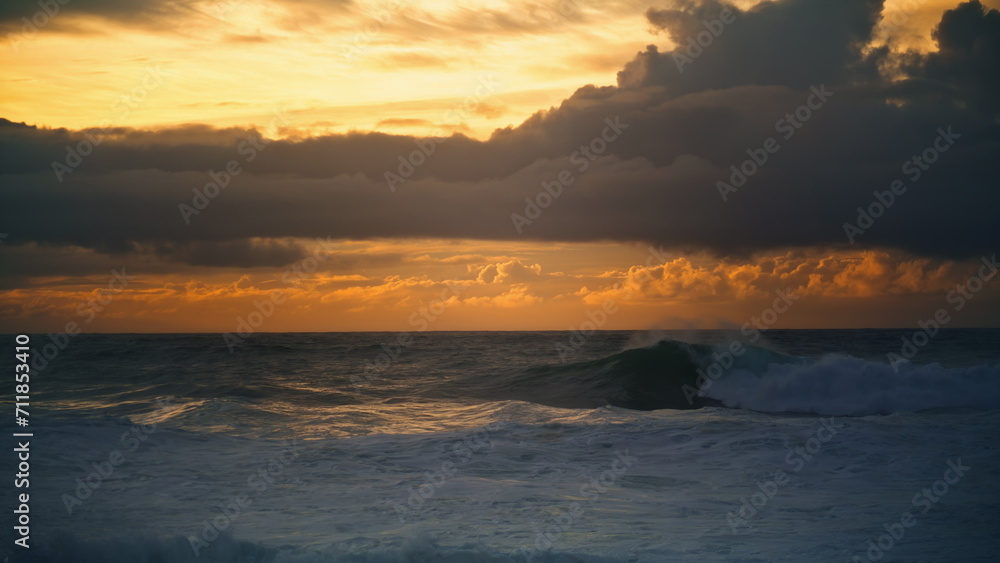 Sea waves barreling shore on sunset. Breathtaking seascape nature landscape view