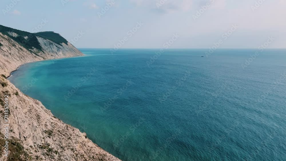 Panoramic view of the sea surface from the coast. Black Sea, Anapa, Krasnodar Territory, Russia. Sunset view of Bald Mountain near the village of Supseh. The beach has 800 steps. 4K Video Panoramic view of the sea surface from the coast. Black Sea, Anapa, Krasnodar Territory, Russia. Sunset view of Bald Mountain near the village of Supseh. The beach has 800 steps. 4K Video