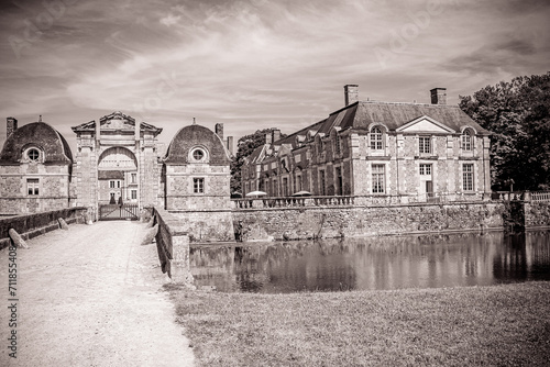 La Ferte Saint Aubin, France, 06-07-2015: Historical castle buildings with old gate and typical french architecture photo