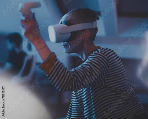 woman wearing headsets of virtual reality standing on background looking away