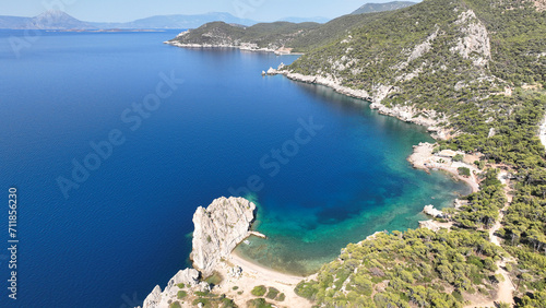 Aerial drone photo of not so famous but paradise secluded sterna beach with crystal clear emerald sea near iconic lake Vouliagmenis, Loutraki, Greece