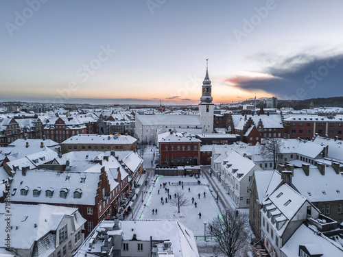 Tela Aerial white winter cityscape of the Aalborg old town covered with snow